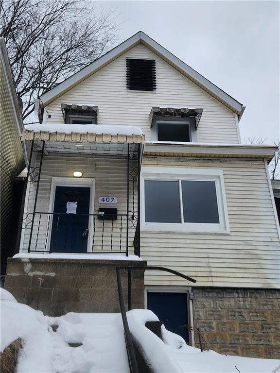 407 Alexander Street McKees Rocks, PA 15136 - Photo 1 of 6 a front view of a house with large windows