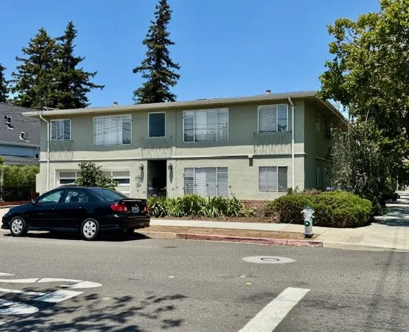 a black car in front of a house