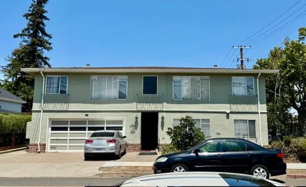 a car parked in front of a house
