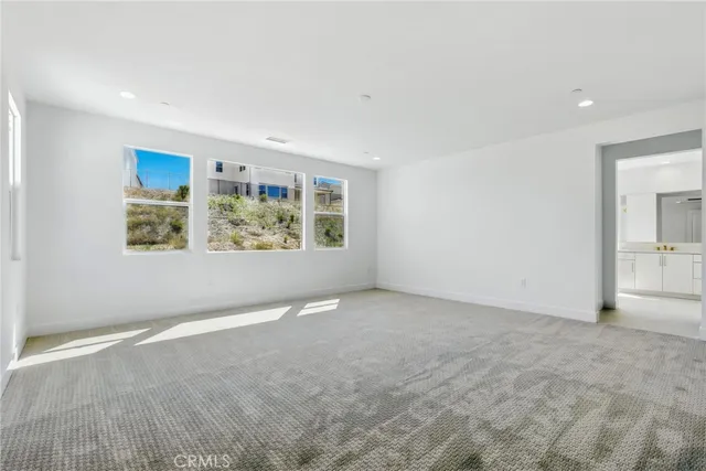 a bathroom with a double vanity sink a bathtub and window