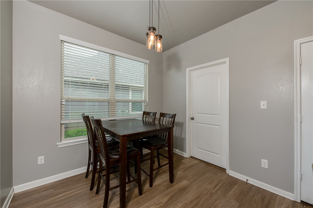 2018 Stubbs Drive Bryan, TX 77807 - Photo 20 of 41 a view of a dining room with furniture window and wooden floor