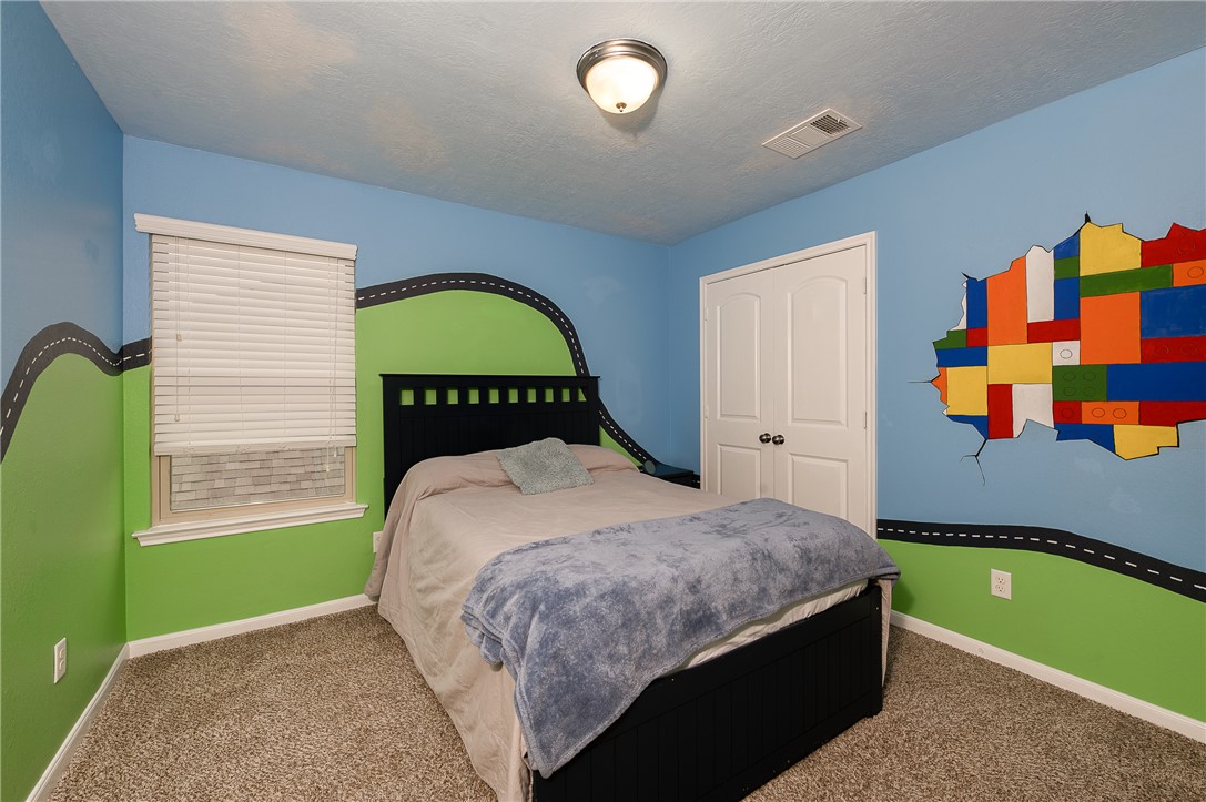 2018 Stubbs Drive Bryan, TX 77807 - Photo 33 of 41 a bedroom with a bed and a window