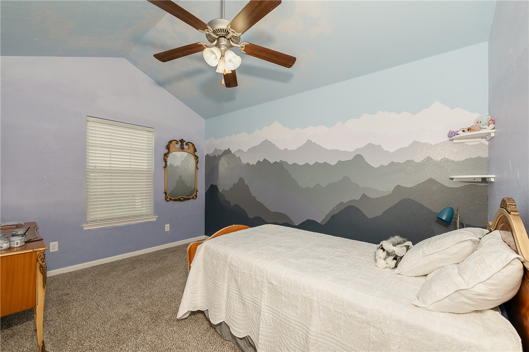 2018 Stubbs Drive Bryan, TX 77807 - Photo 35 of 41 a bedroom with a bed and a painting on the wall