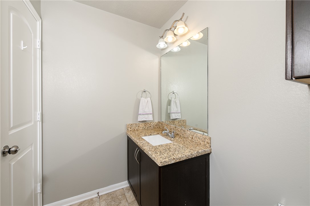 2018 Stubbs Drive Bryan, TX 77807 - Photo 7 of 41 a bathroom with a sink and a mirror