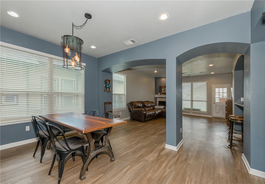 2018 Stubbs Drive Bryan, TX 77807 - Photo 10 of 41 a view of a dining room with furniture and wooden floor