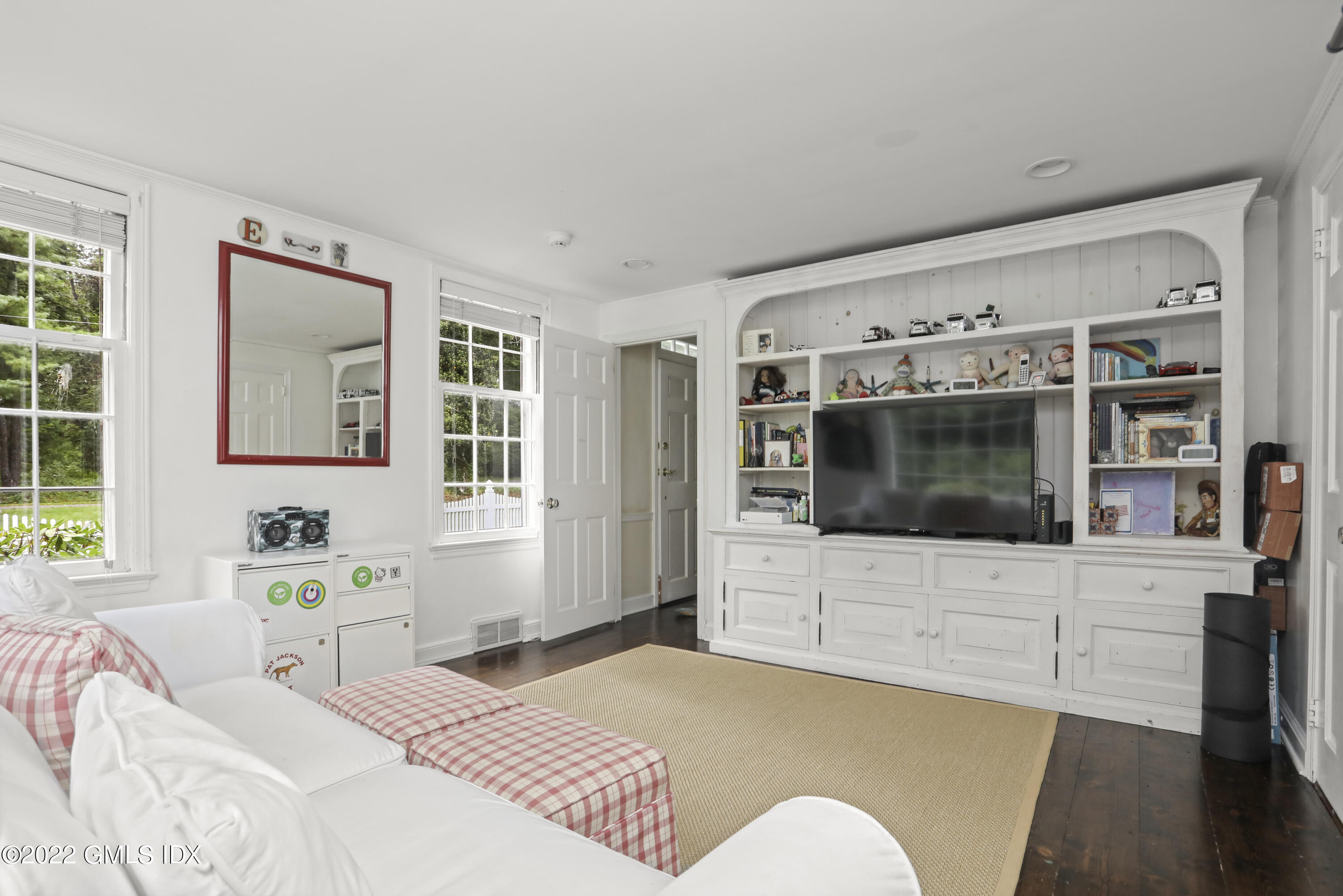 92 Round Hill Road Greenwich, CT 06831 - Photo 8 of 23 a bedroom with a bed and a flat screen tv