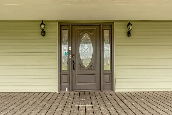 a view of a entryway door with wooden floor