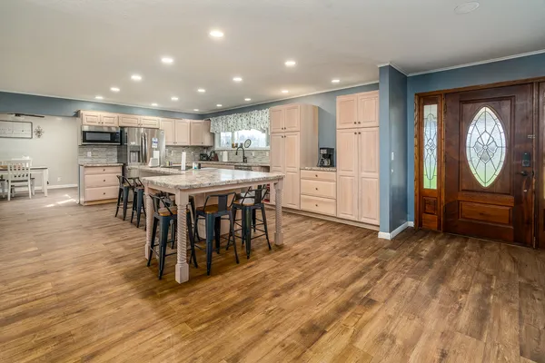 a view of kitchen with cabinets and wooden floor