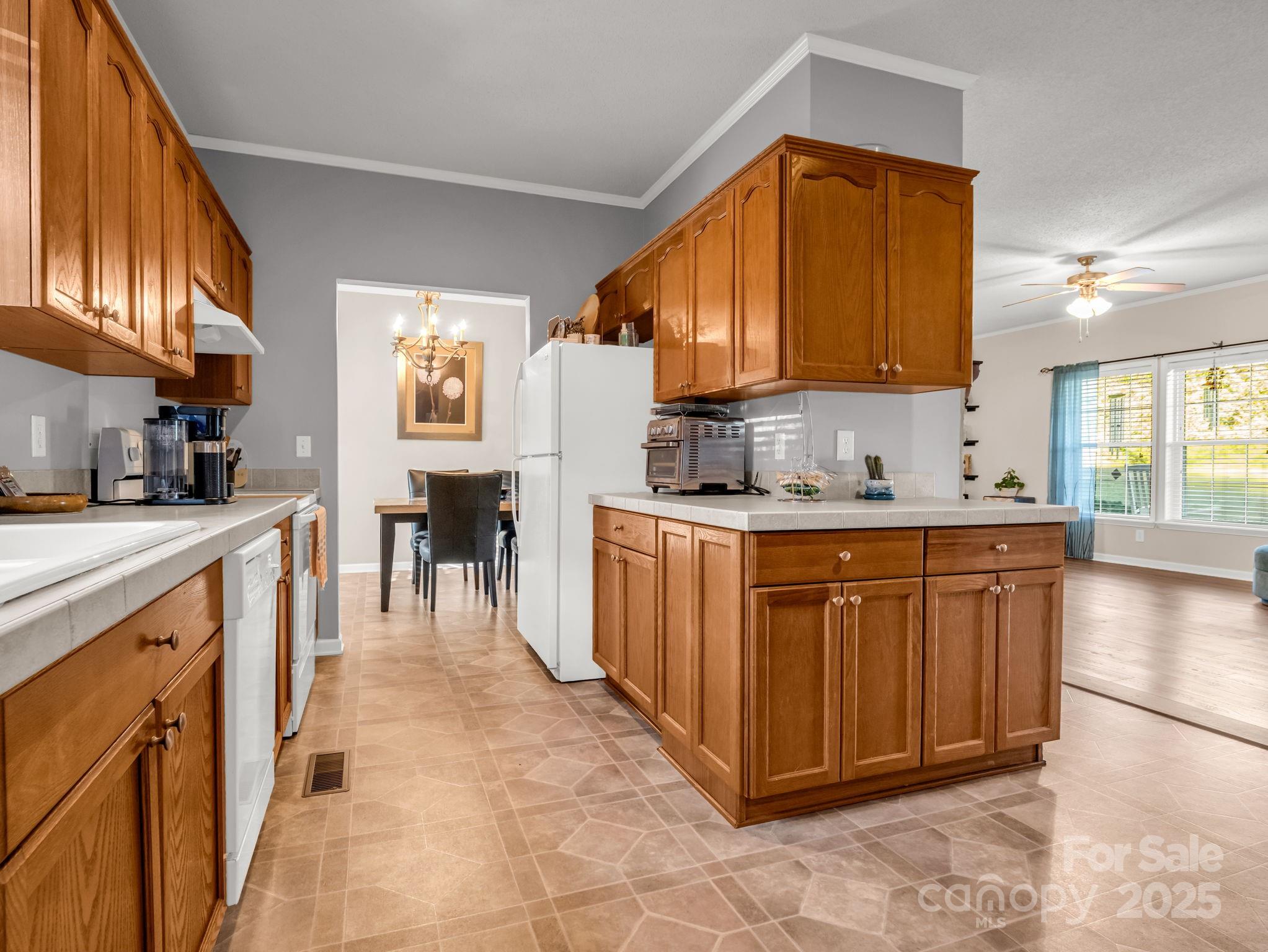 435 Brooks Road Bostic, NC 28018 - Photo 12 of 41 a kitchen with stainless steel appliances granite countertop a sink and cabinets
