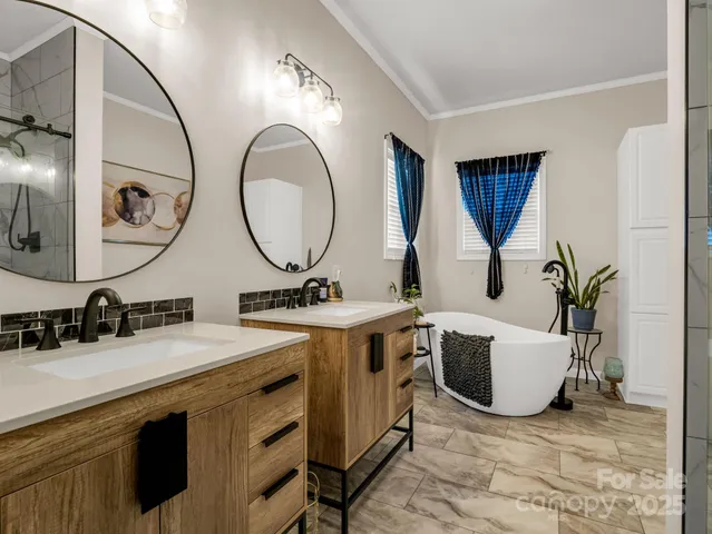 a bathroom with a double vanity sink and a mirror