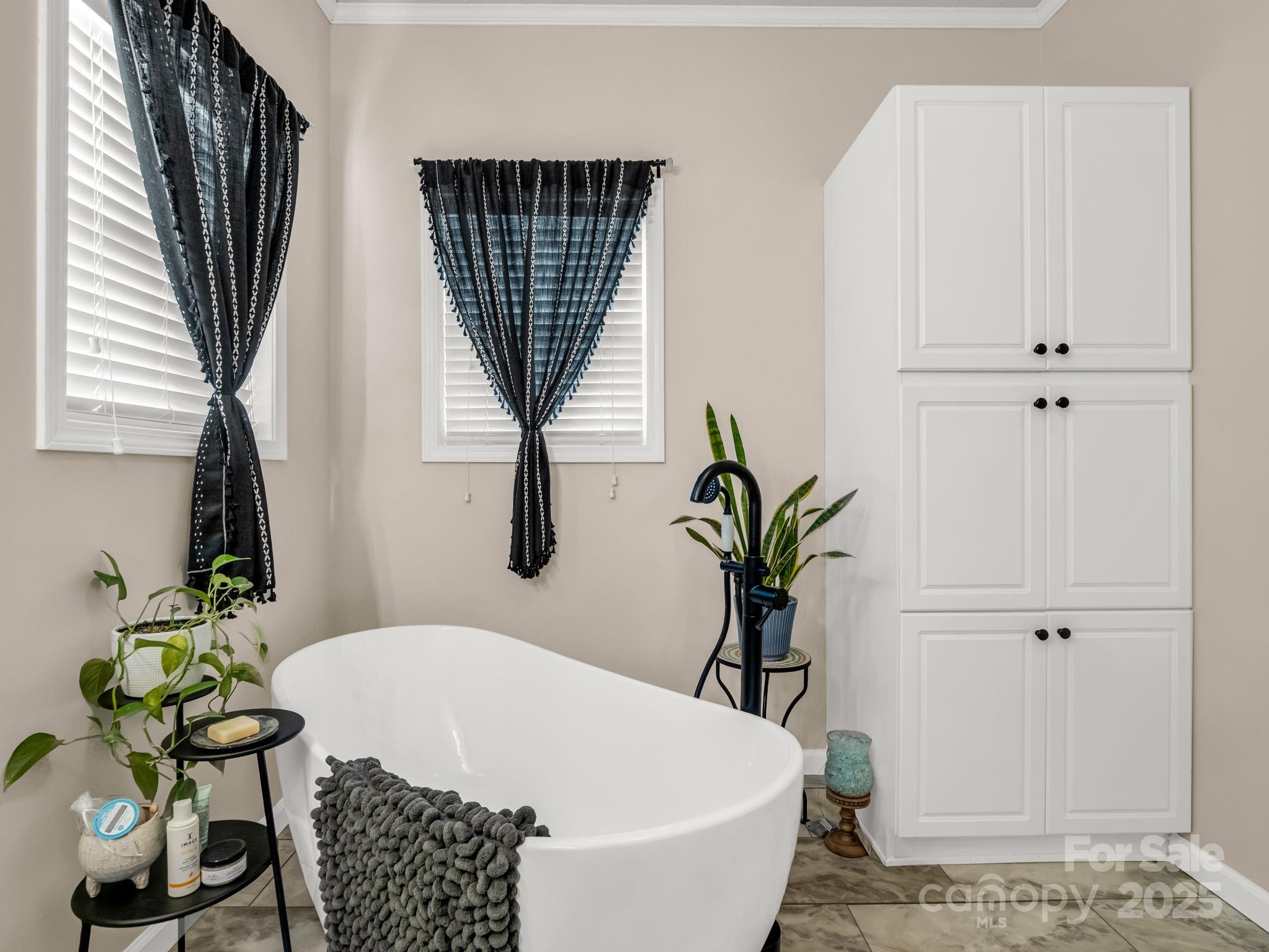 435 Brooks Road Bostic, NC 28018 - Photo 21 of 41 a white bath tub sitting in a bathroom next to a window