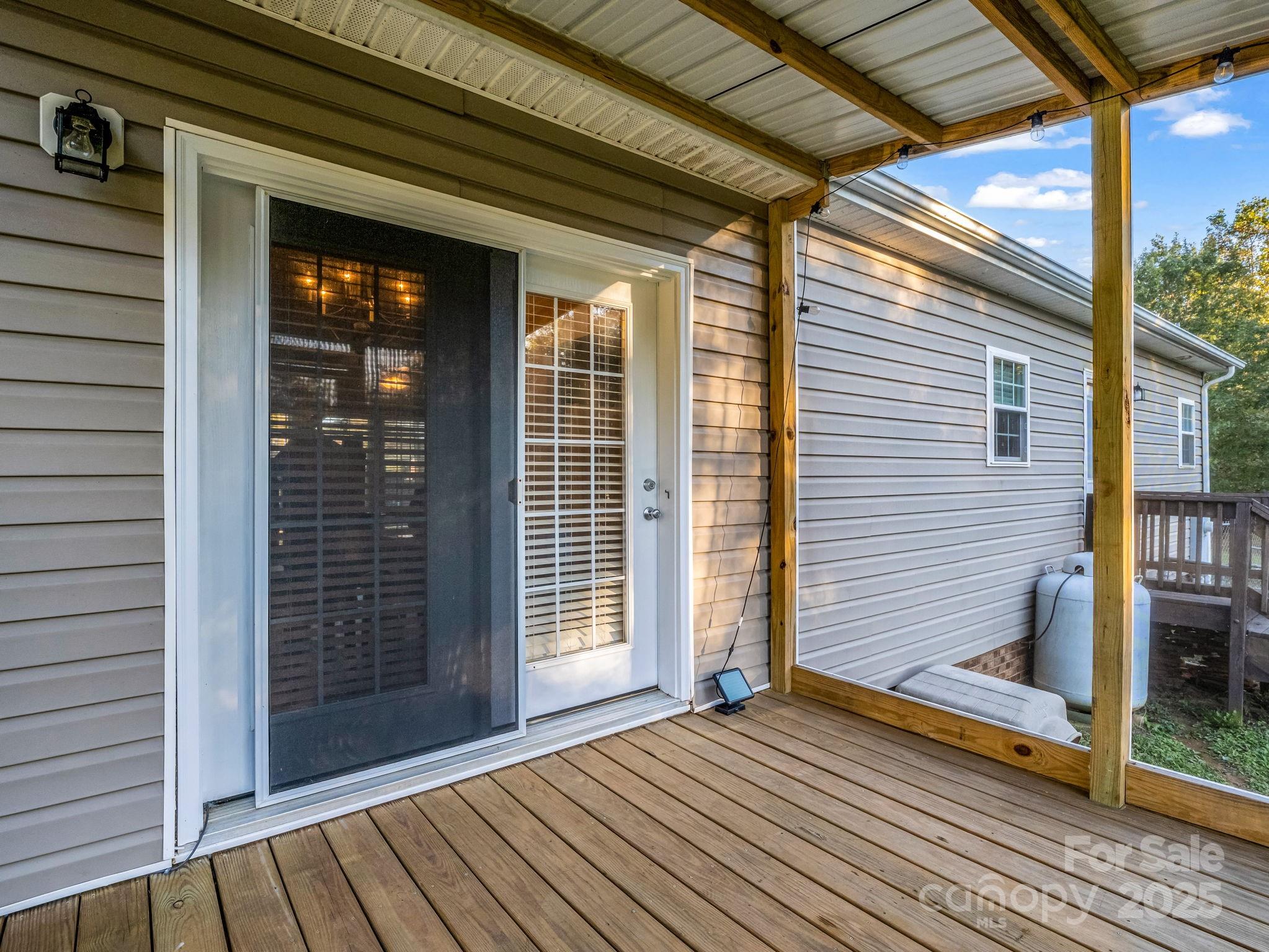 435 Brooks Road Bostic, NC 28018 - Photo 29 of 41 a view of a backyard with wooden floor and floor to ceiling window