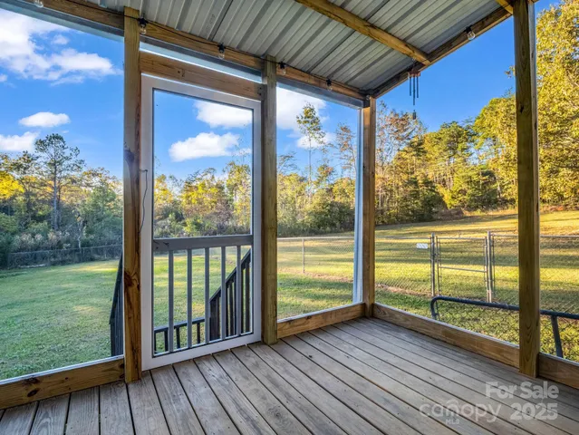 a view of a porch with wooden floor