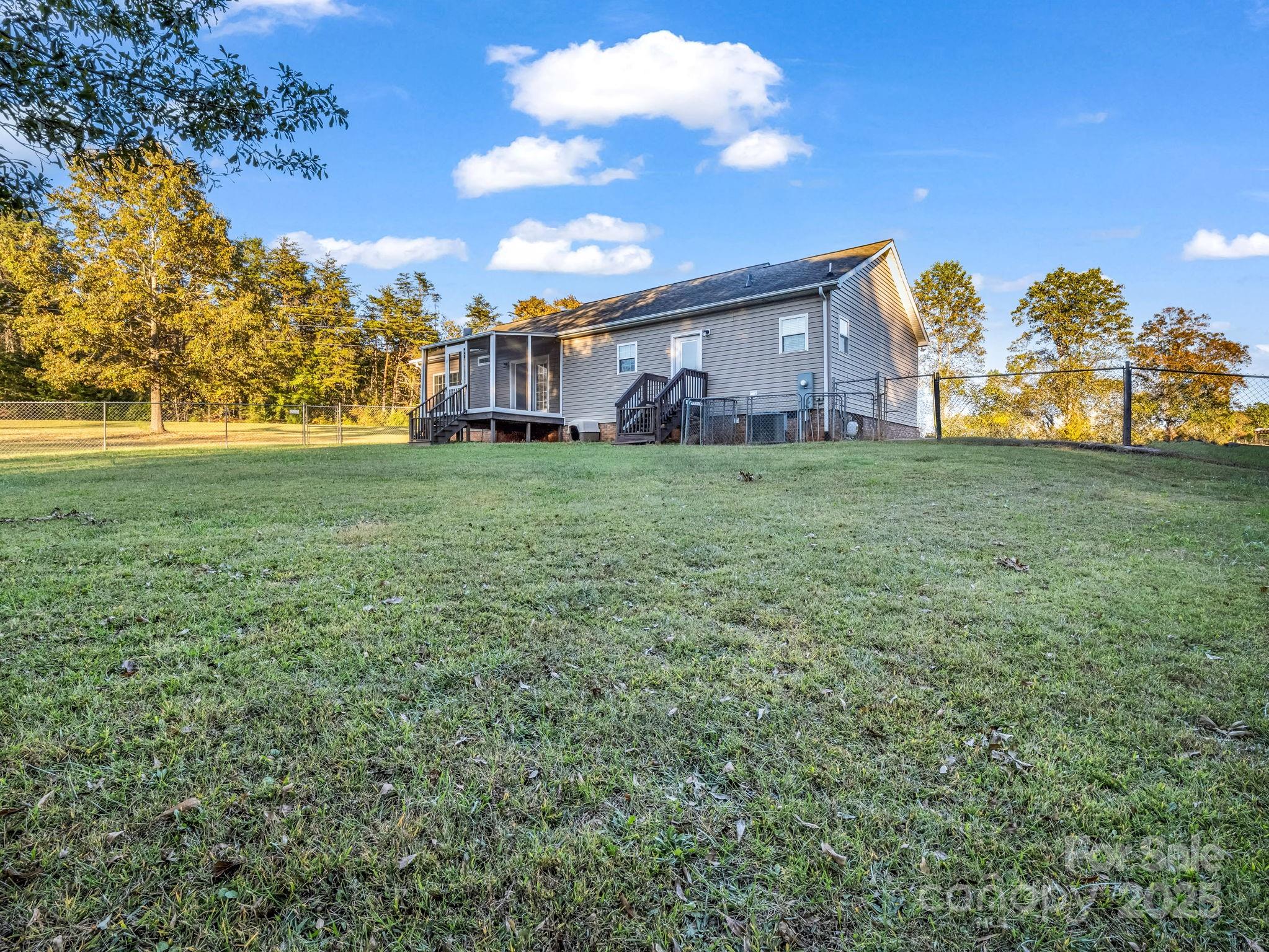 435 Brooks Road Bostic, NC 28018 - Photo 37 of 41 a view of a big house with a big yard and large trees