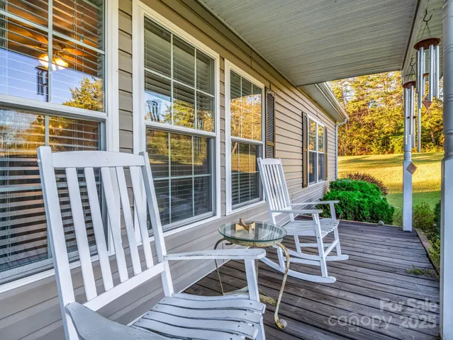 a view of a patio with a table and chairs