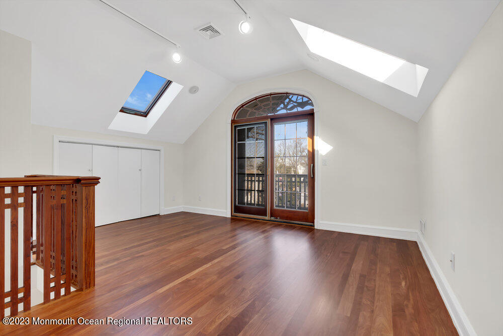 511 Passaic Avenue Spring Lake, NJ 07762 - Photo 102 of 105 wooden floor in an empty room with a window