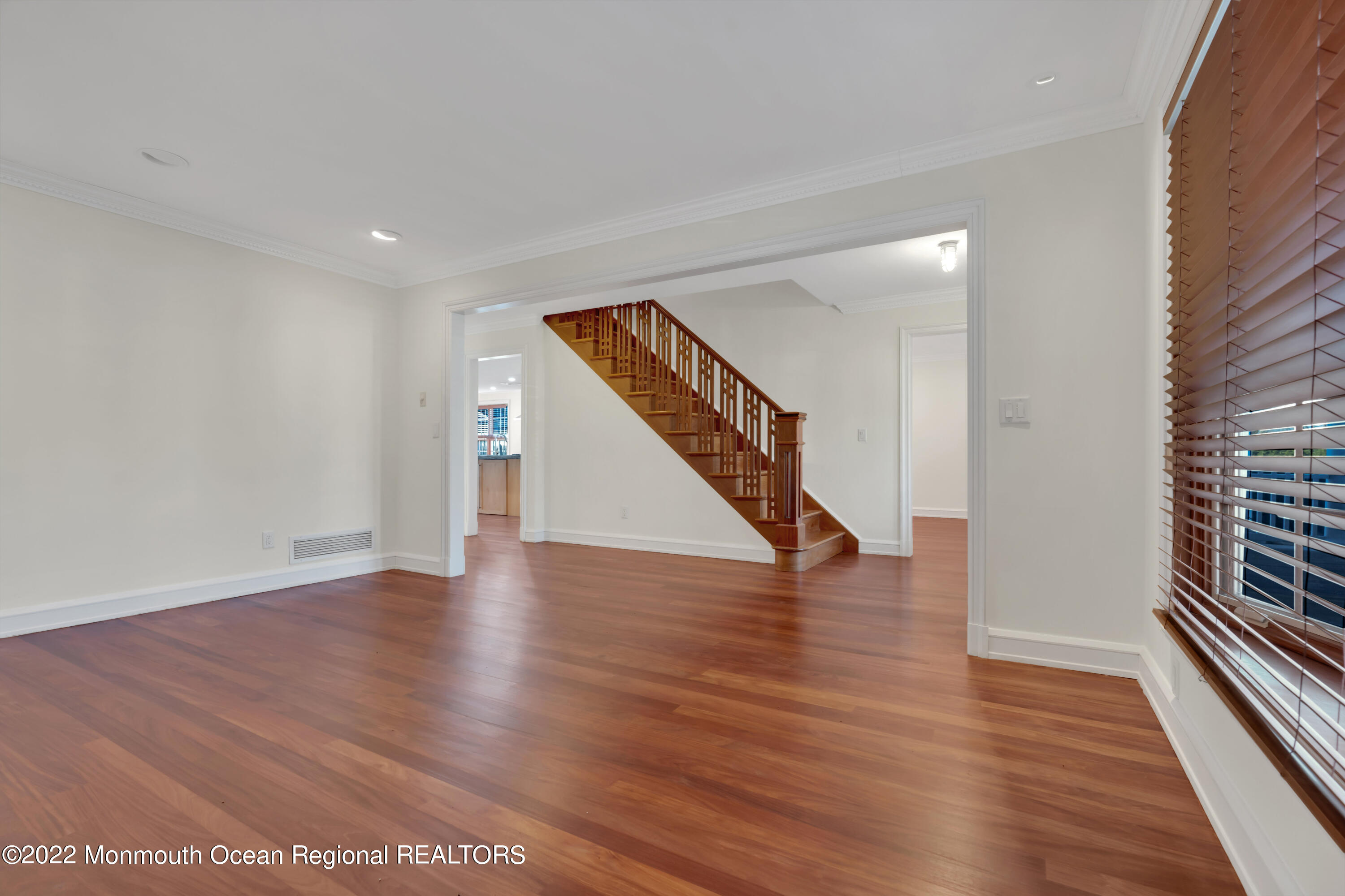 511 Passaic Avenue Spring Lake, NJ 07762 - Photo 24 of 105 a view of an empty room with wooden floor and stairs