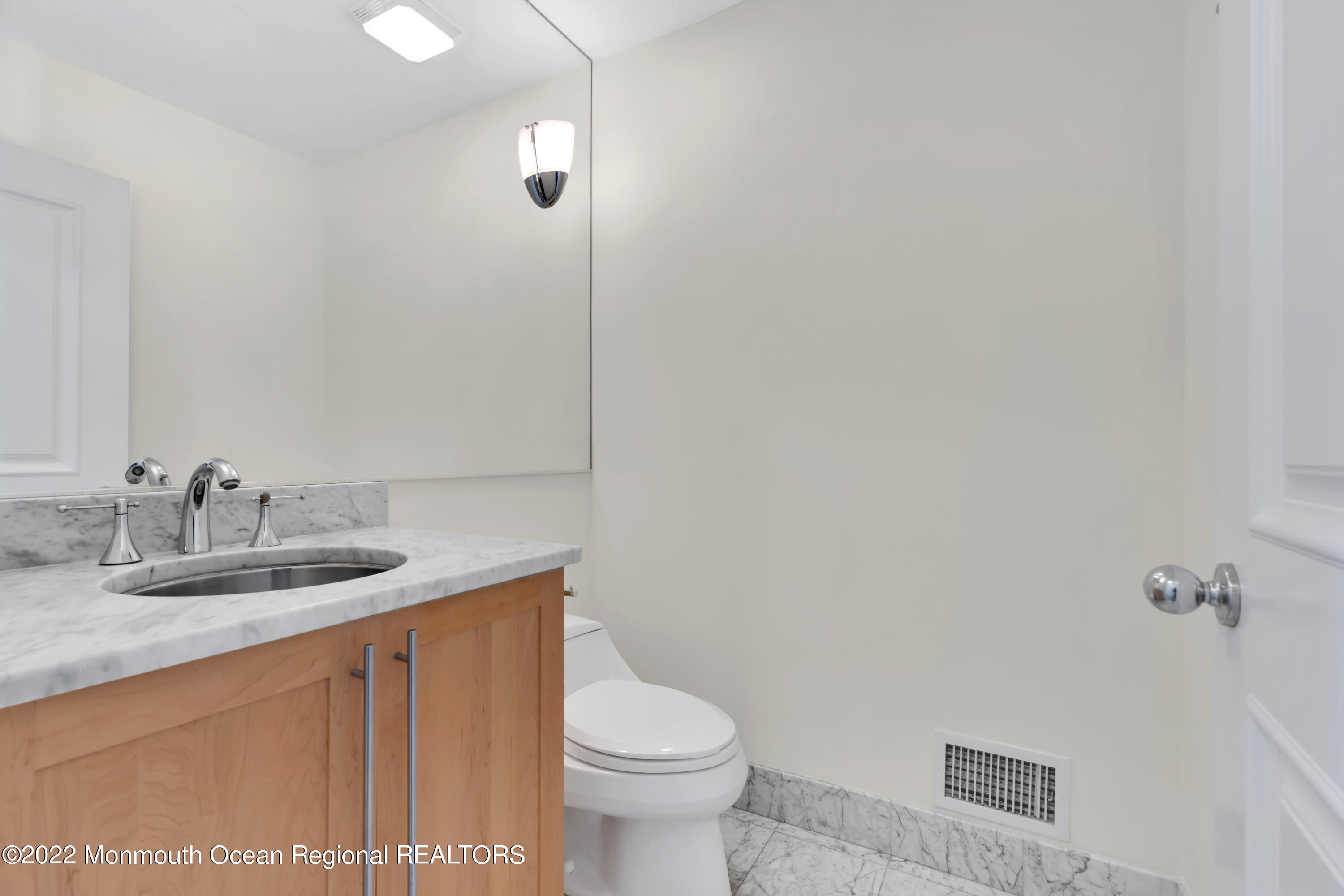 511 Passaic Avenue Spring Lake, NJ 07762 - Photo 25 of 105 a bathroom with a granite countertop sink a toilet and a mirror