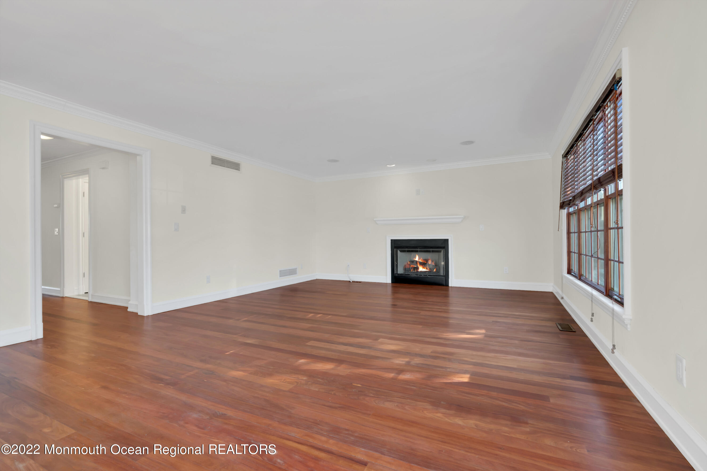 511 Passaic Avenue Spring Lake, NJ 07762 - Photo 36 of 105 a view of an empty room with wooden floor and a window