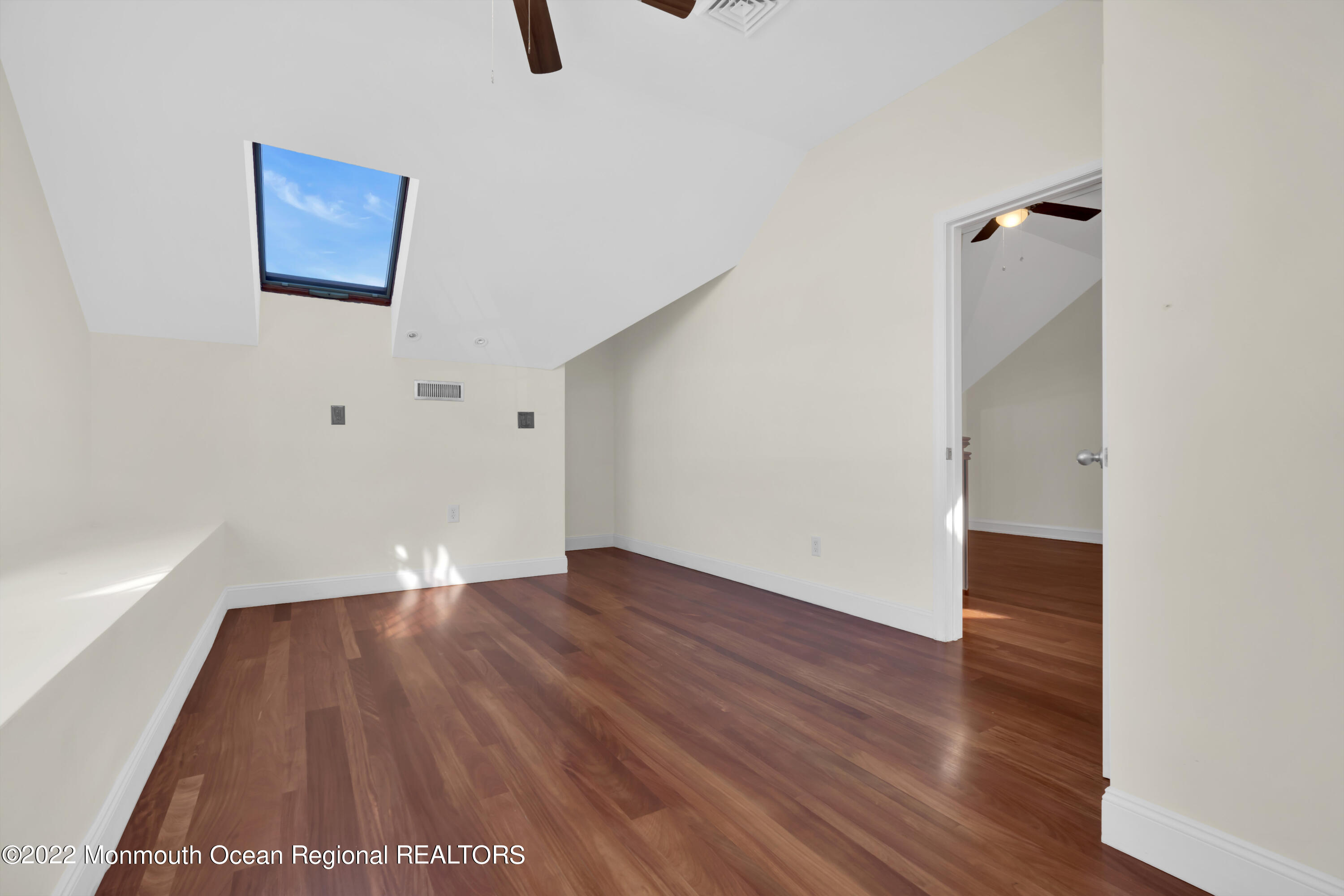 511 Passaic Avenue Spring Lake, NJ 07762 - Photo 42 of 105 an empty room with wooden floor and windows