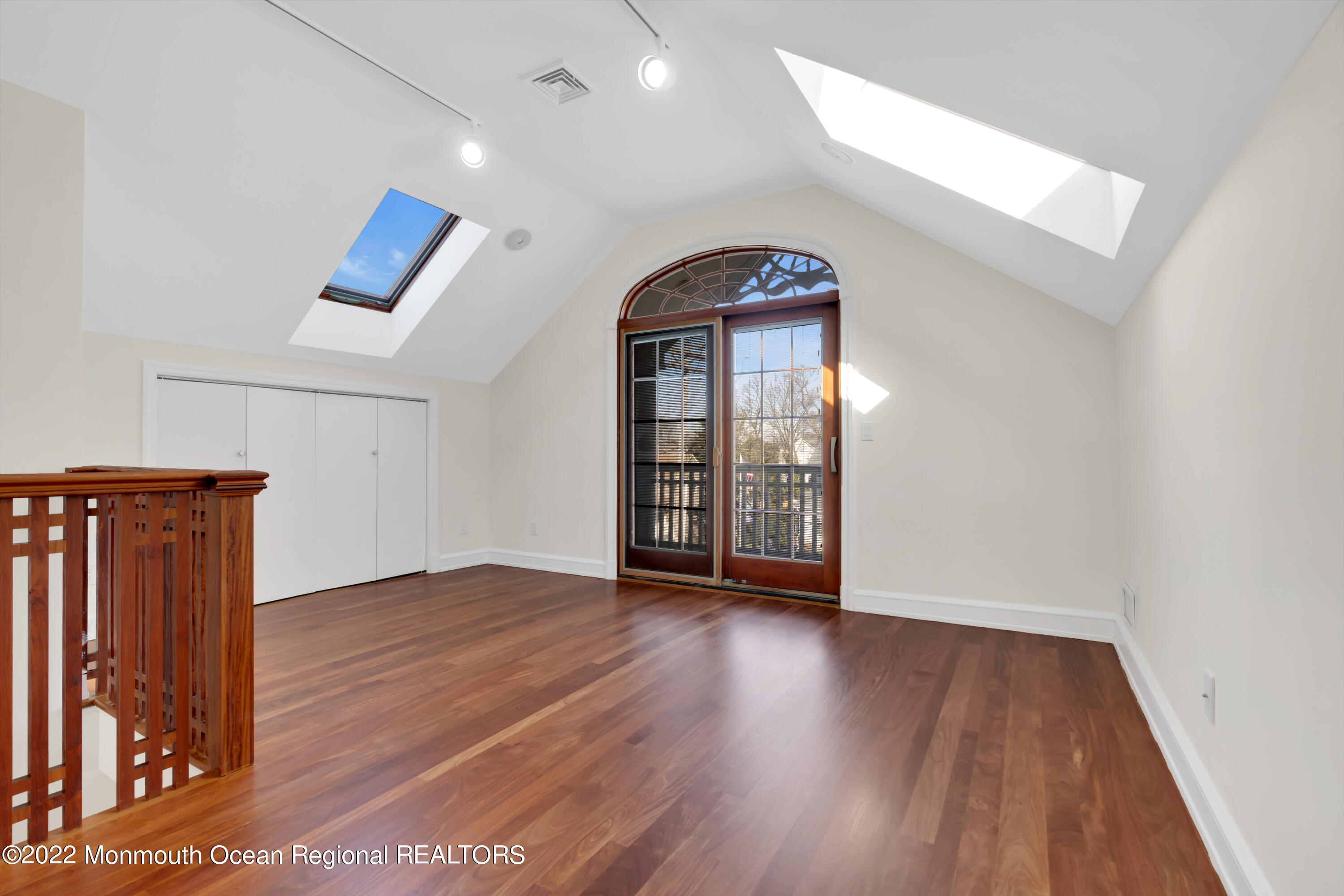 511 Passaic Avenue Spring Lake, NJ 07762 - Photo 46 of 105 wooden floor in an empty room with a window