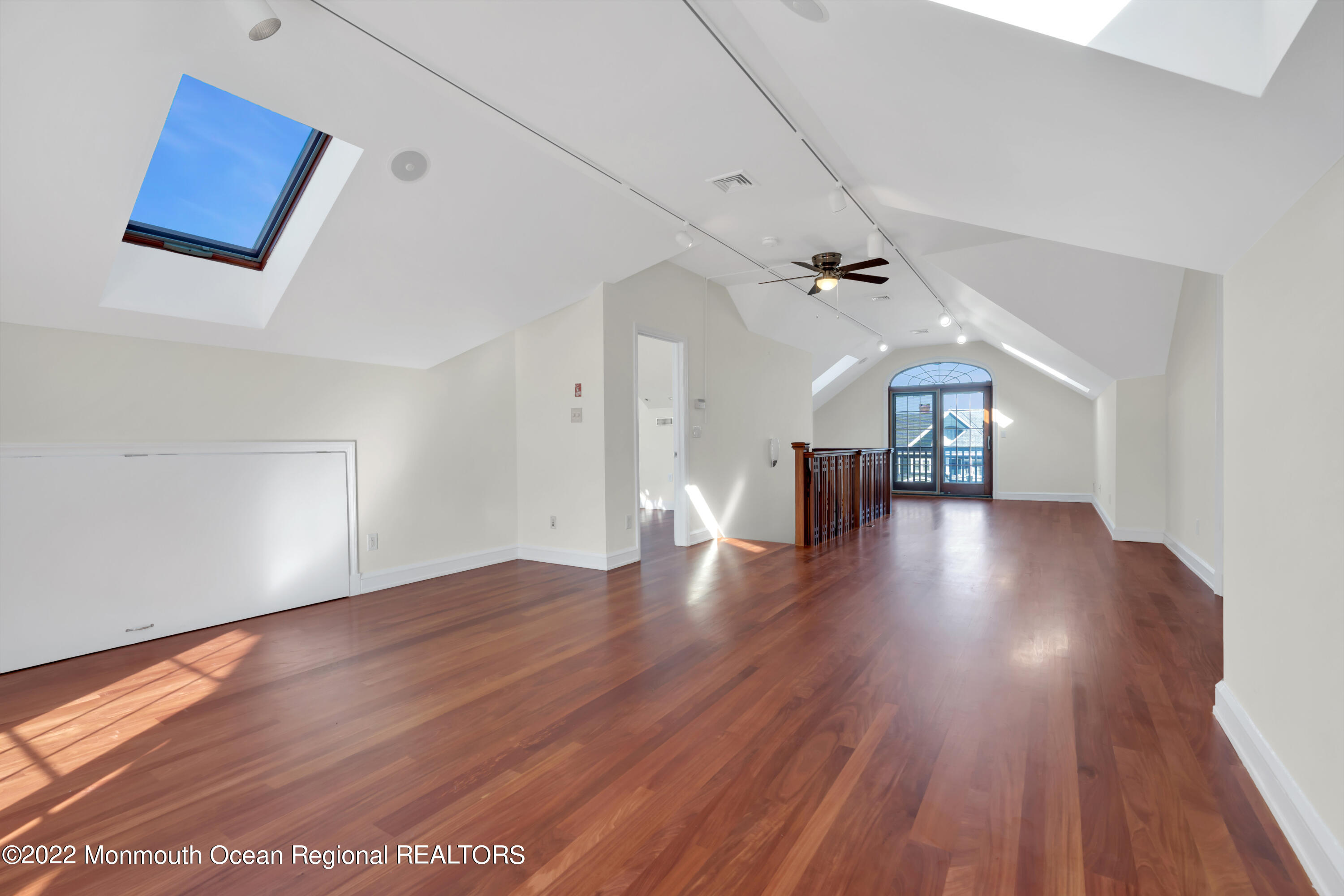 511 Passaic Avenue Spring Lake, NJ 07762 - Photo 48 of 105 wooden floor in an empty room with a window