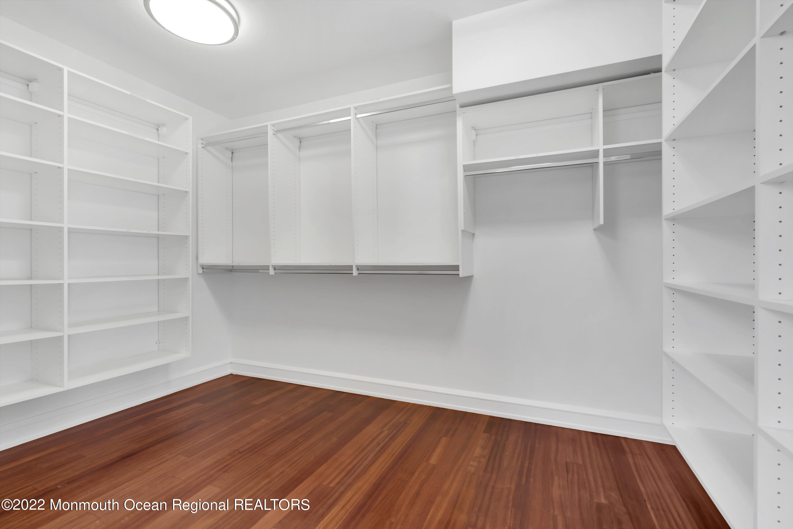 511 Passaic Avenue Spring Lake, NJ 07762 - Photo 53 of 105 a view of an empty room with wooden floor and closet