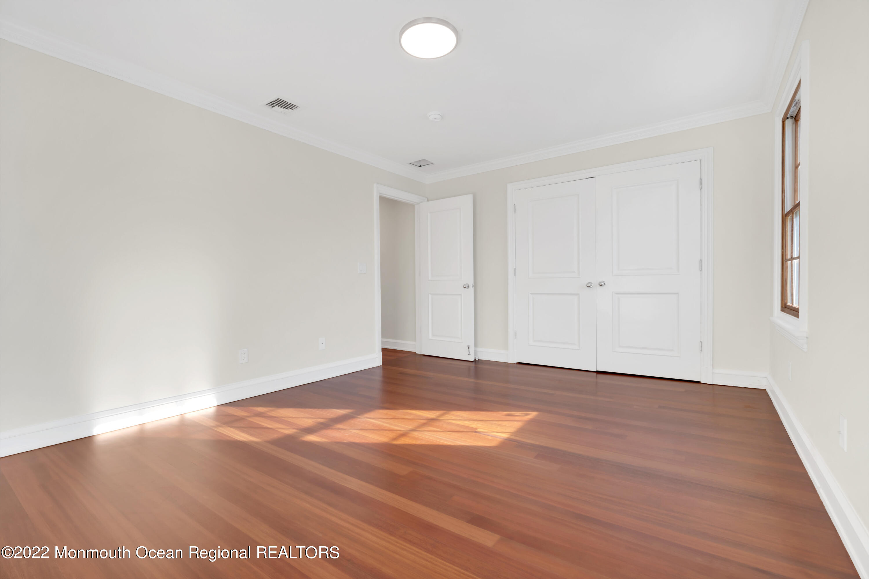 511 Passaic Avenue Spring Lake, NJ 07762 - Photo 60 of 105 a view of an empty room with wooden floor