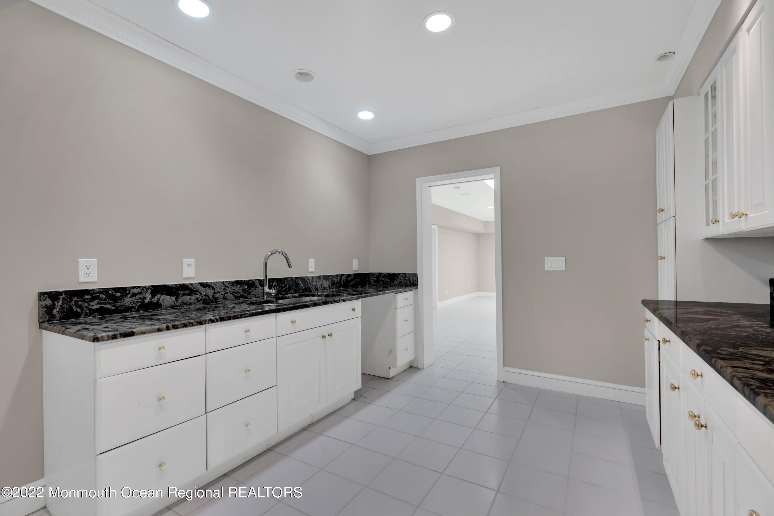 511 Passaic Avenue Spring Lake, NJ 07762 - Photo 67 of 105 a kitchen with granite countertop a sink and a stove top oven