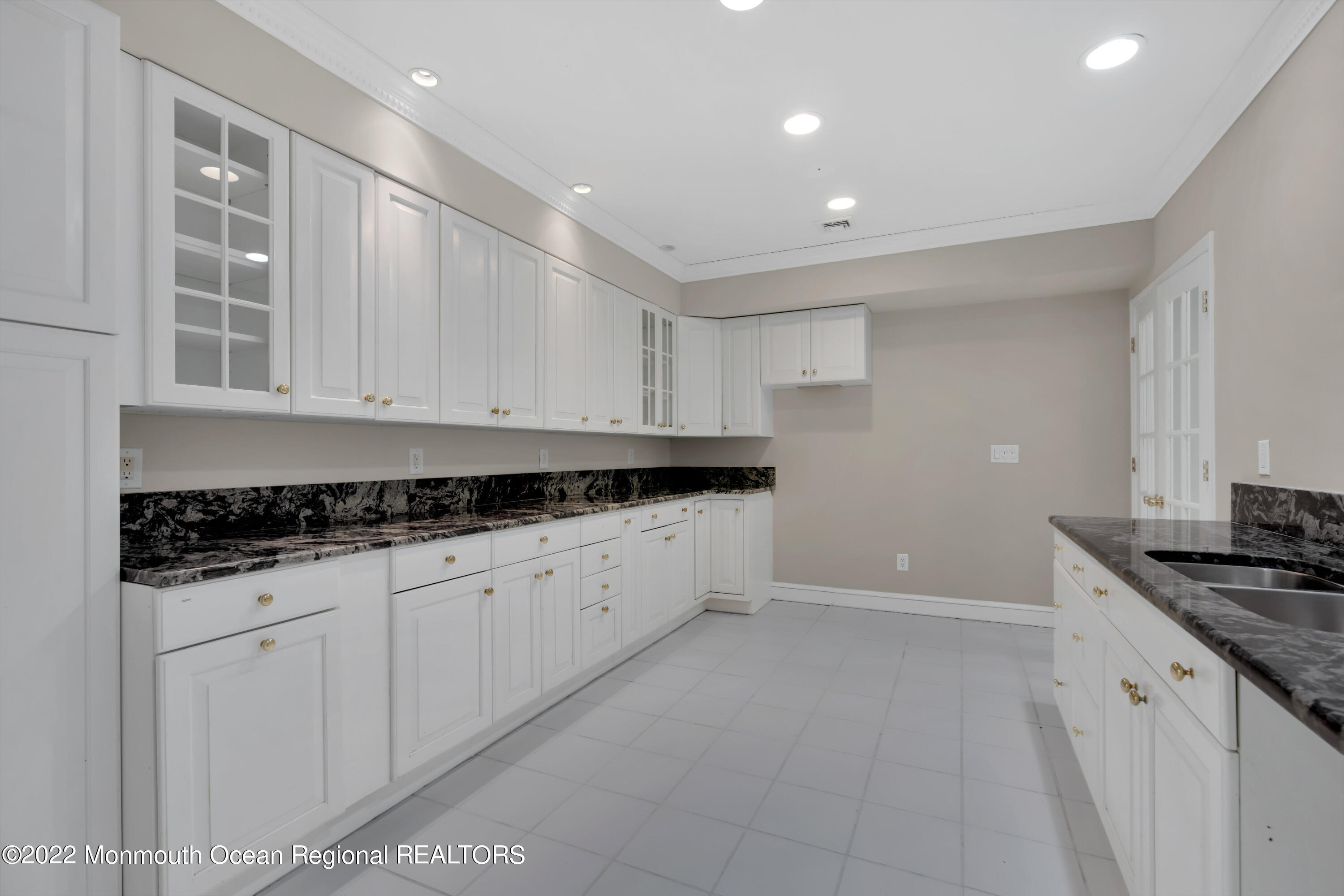 511 Passaic Avenue Spring Lake, NJ 07762 - Photo 68 of 105 a kitchen with granite countertop a sink and cabinets