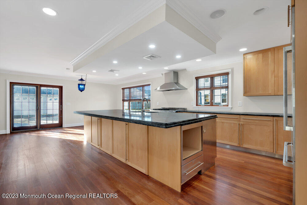 511 Passaic Avenue Spring Lake, NJ 07762 - Photo 92 of 105 a kitchen with stainless steel appliances granite countertop a stove a sink and a refrigerator