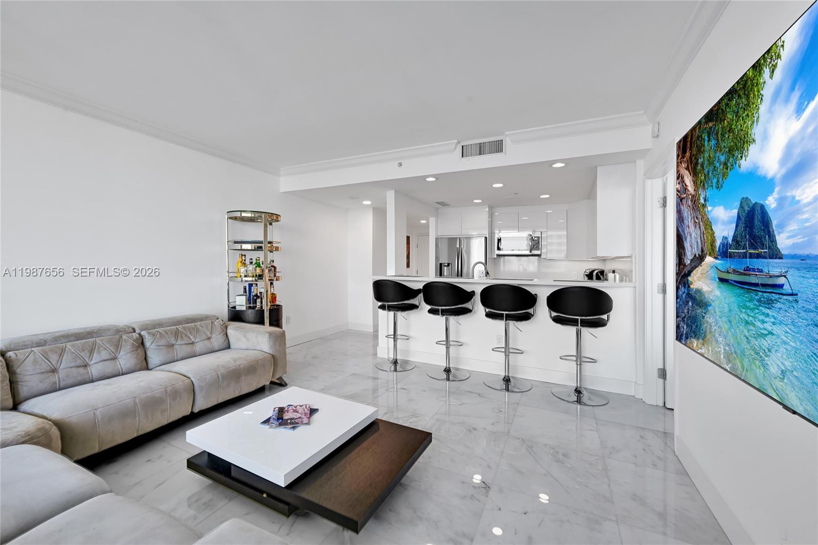 a living room with furniture and a rug