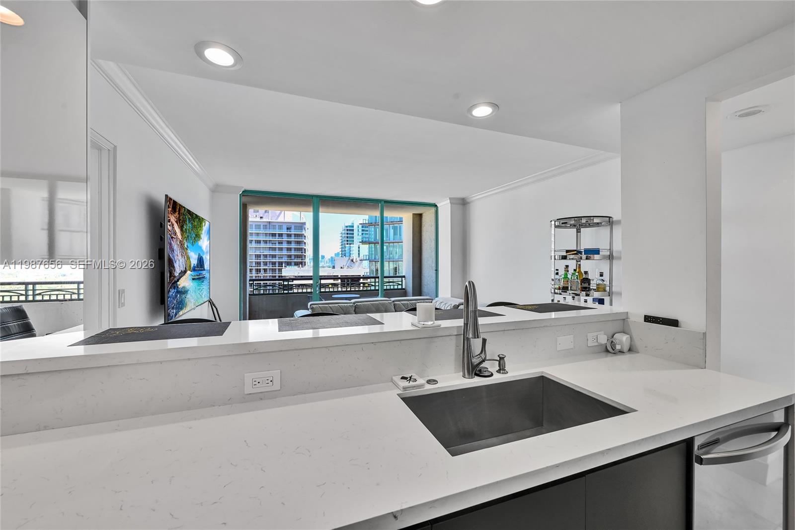 3350 Southwest 27th Avenue, Unit 1908 Coconut Grove, FL 33133 - Photo 15 of 17 a kitchen with a sink and a window