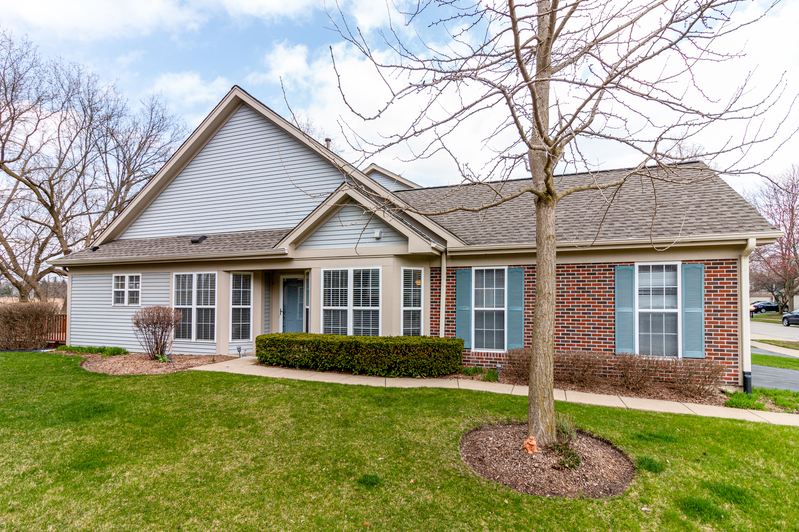 1176 Coldspring Road Elgin, IL 60120 - Photo 2 of 24 a front view of a house with a yard and trees