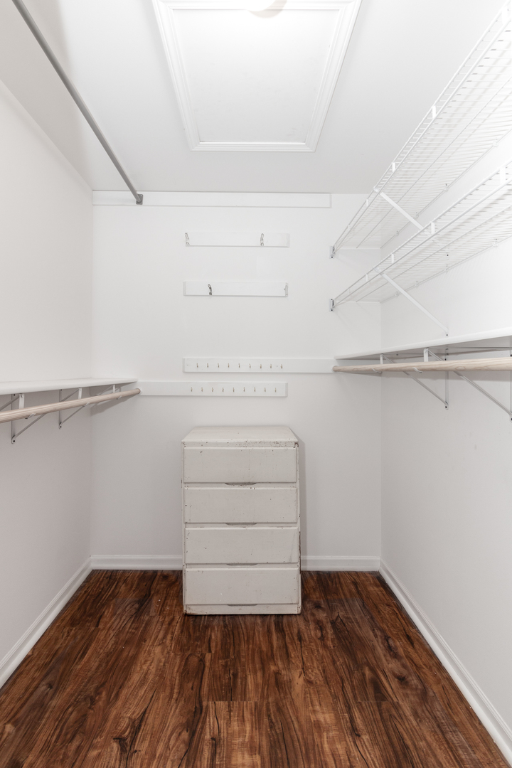 1176 Coldspring Road Elgin, IL 60120 - Photo 14 of 24 a view of walk in closet with empty racks