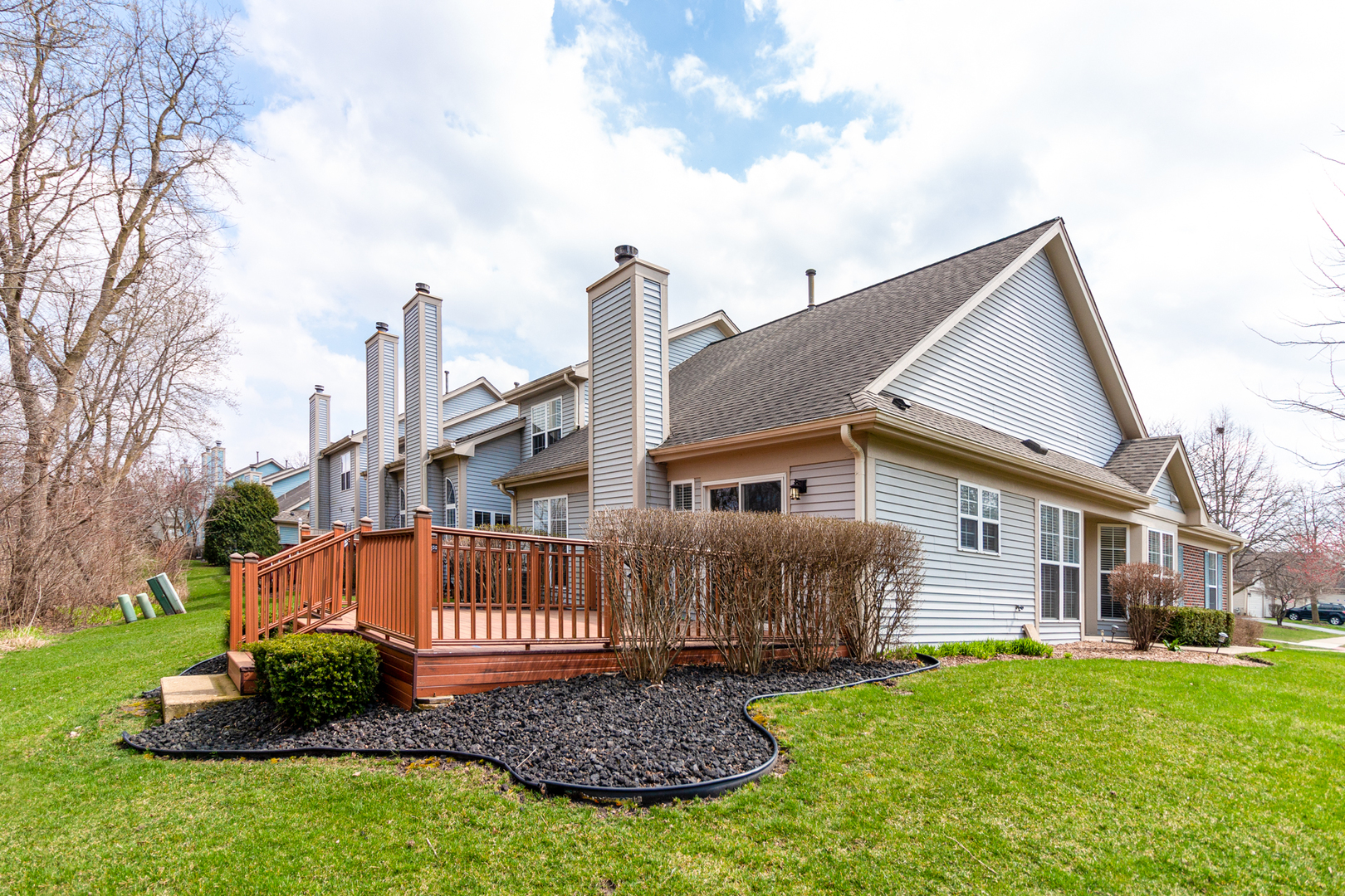 1176 Coldspring Road Elgin, IL 60120 - Photo 22 of 24 a front view of a house with a garden