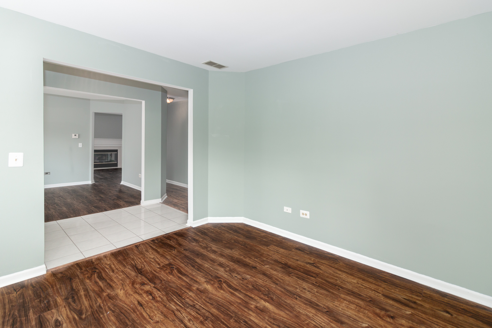1176 Coldspring Road Elgin, IL 60120 - Photo 4 of 24 a bedroom with a bed and wooden floor