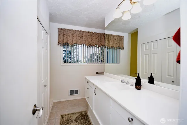 a view of a bedroom from a hallway