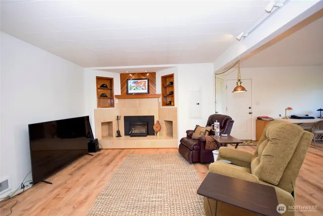 a living room with furniture and a large window