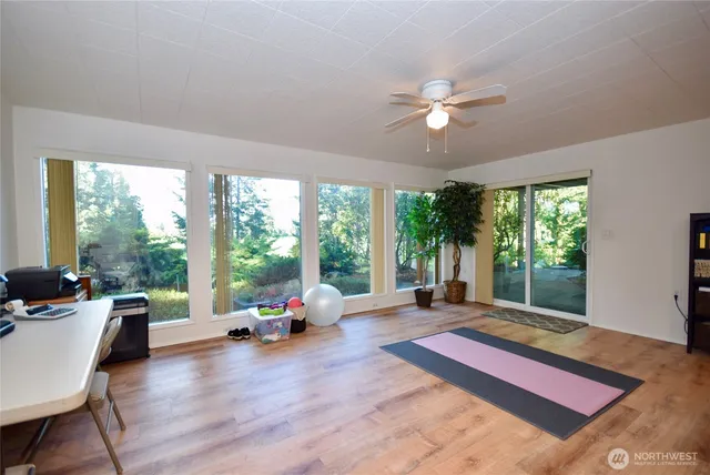 a bedroom with a bed chair and window