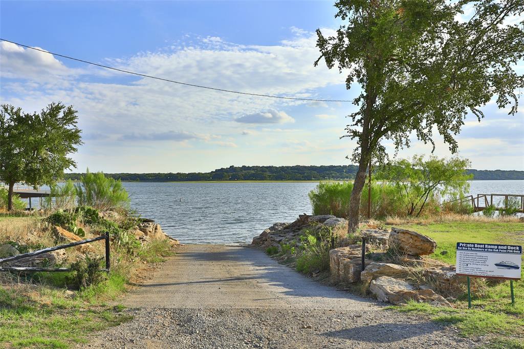 Tbd Oak Point Drive May, TX 76857 - Photo 13 of 14 a view of a lake with lawn chairs