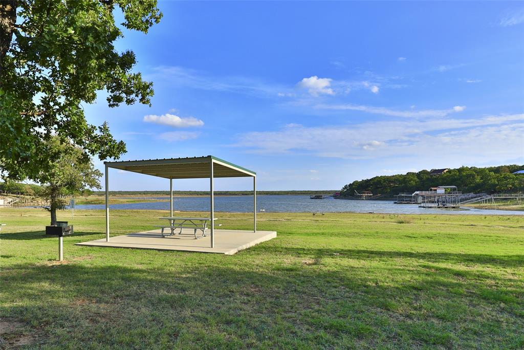 Tbd Oak Point Drive May, TX 76857 - Photo 6 of 14 a view of a swimming pool with an outdoor space and seating area