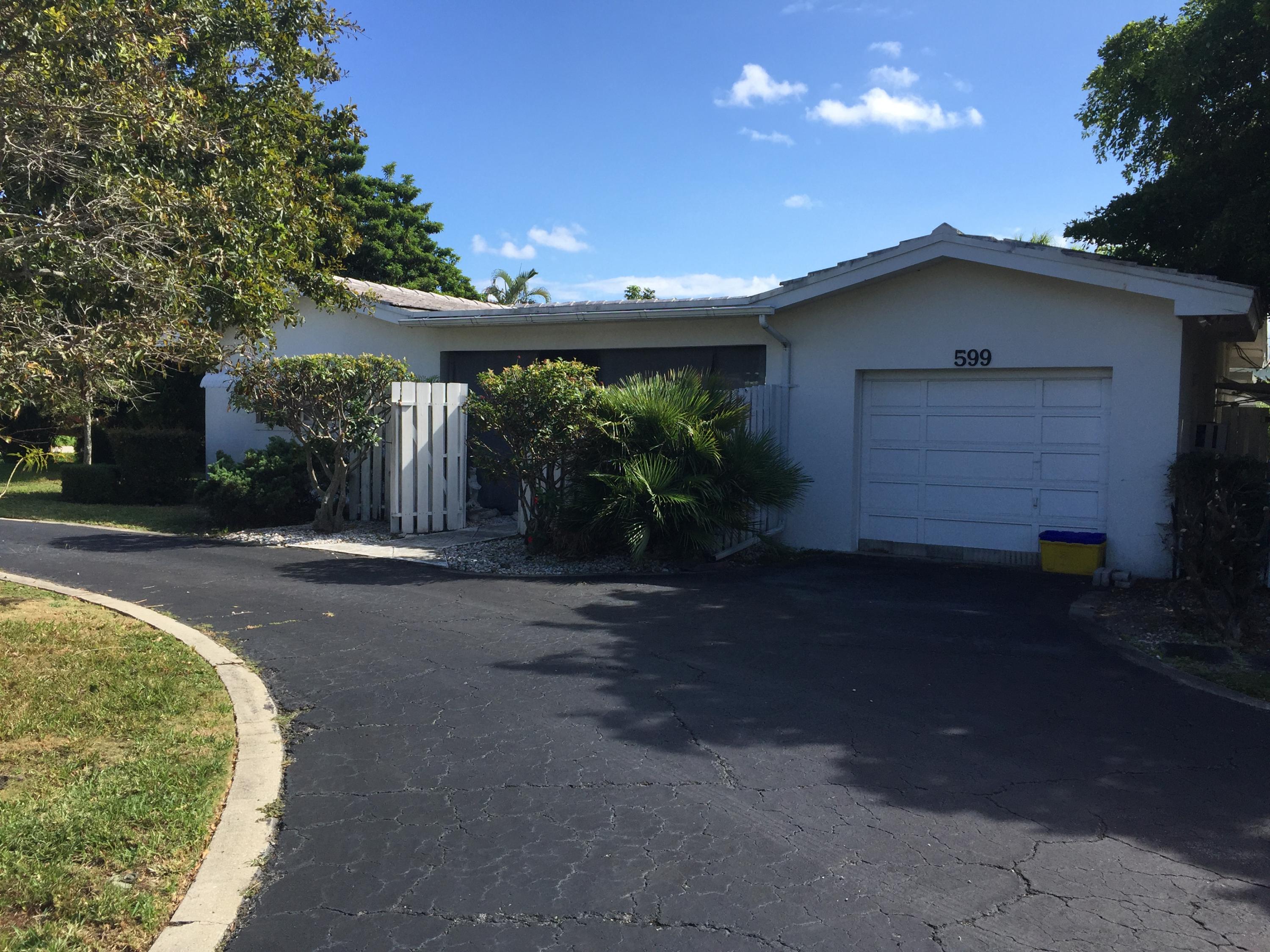 599 Northeast Spanish Court Boca Raton, FL 33432 - Photo 1 of 4 Front