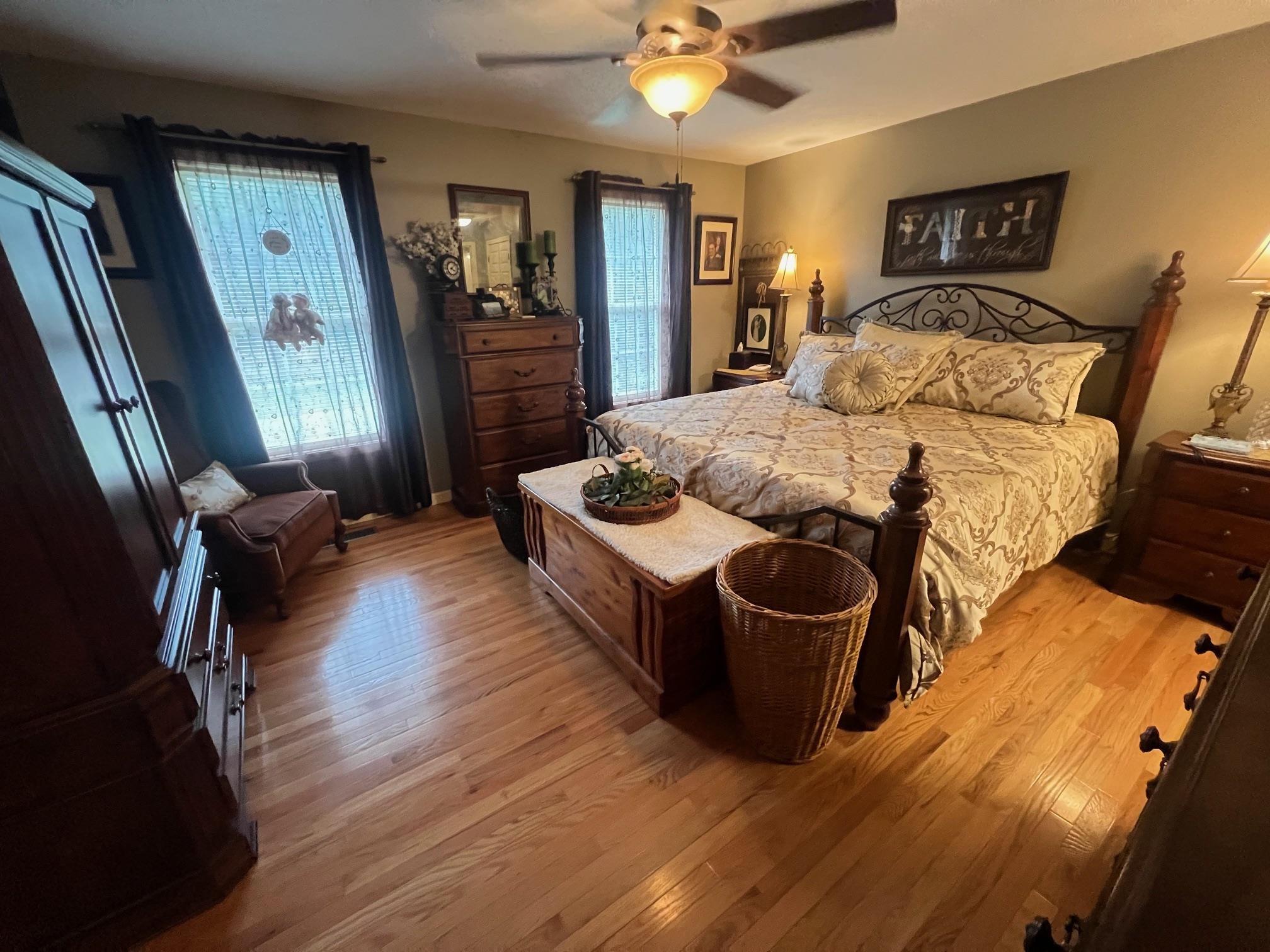 880 Double Springs Loop Savannah, TN 38372 - Photo 11 of 40 a bedroom with a bed and wooden floor