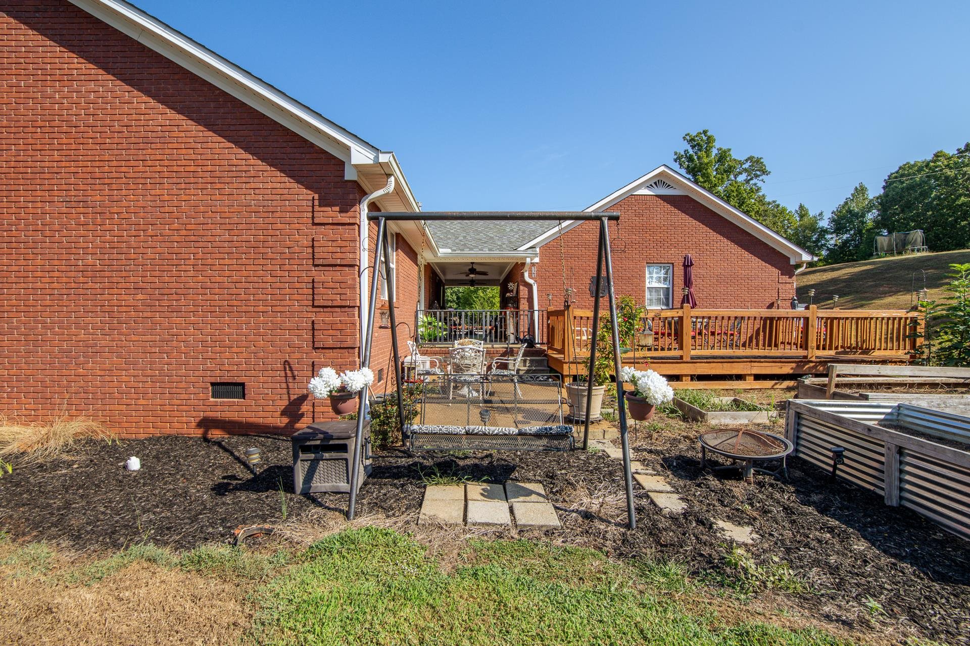 880 Double Springs Loop Savannah, TN 38372 - Photo 21 of 40 a view of a patio with chairs and tables