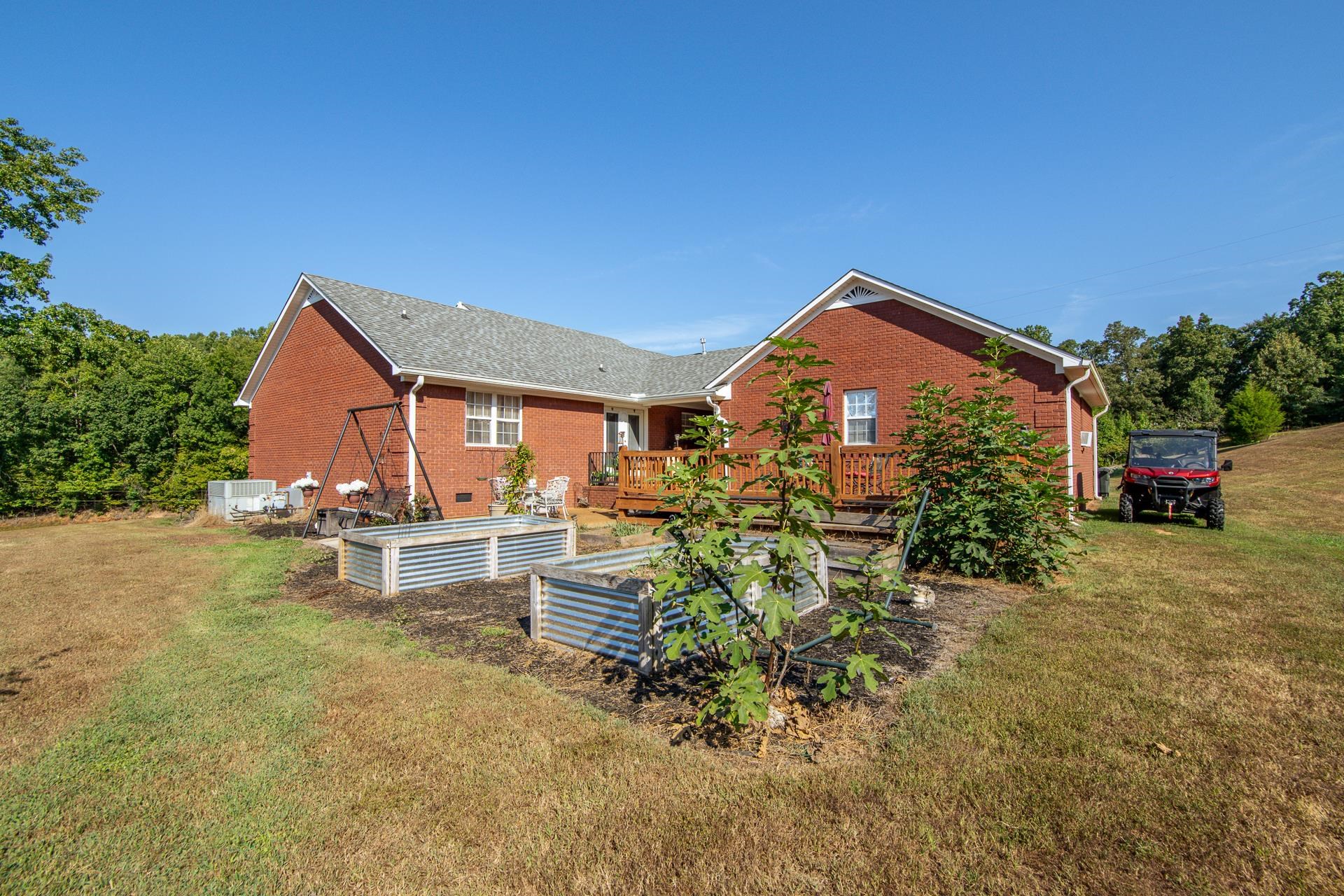 880 Double Springs Loop Savannah, TN 38372 - Photo 23 of 40 a view of a house with a outdoor space