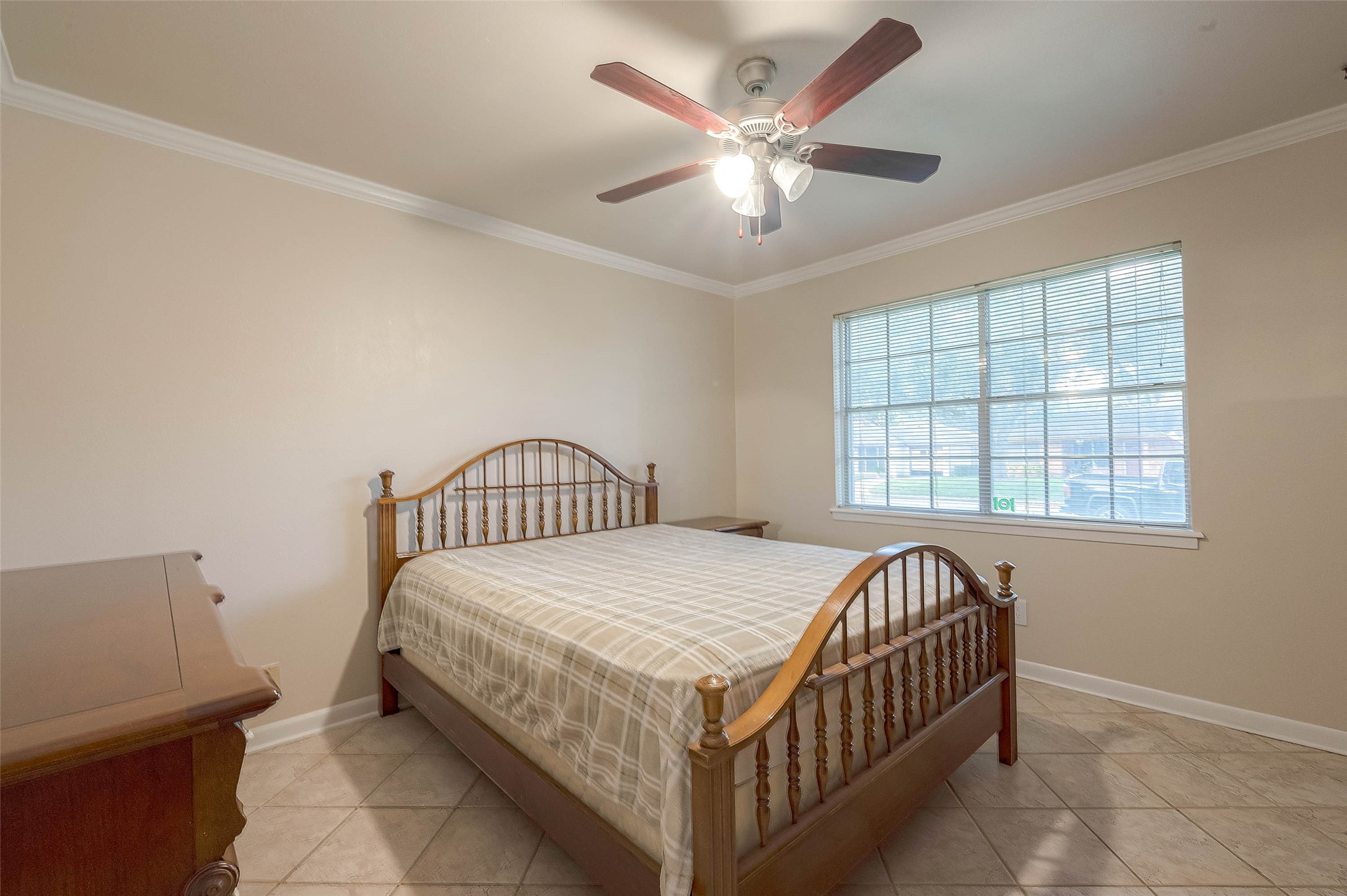 1503 Miles Street Rosenberg, TX 77471 - Photo 12 of 25 a bedroom with a bed and a chandelier