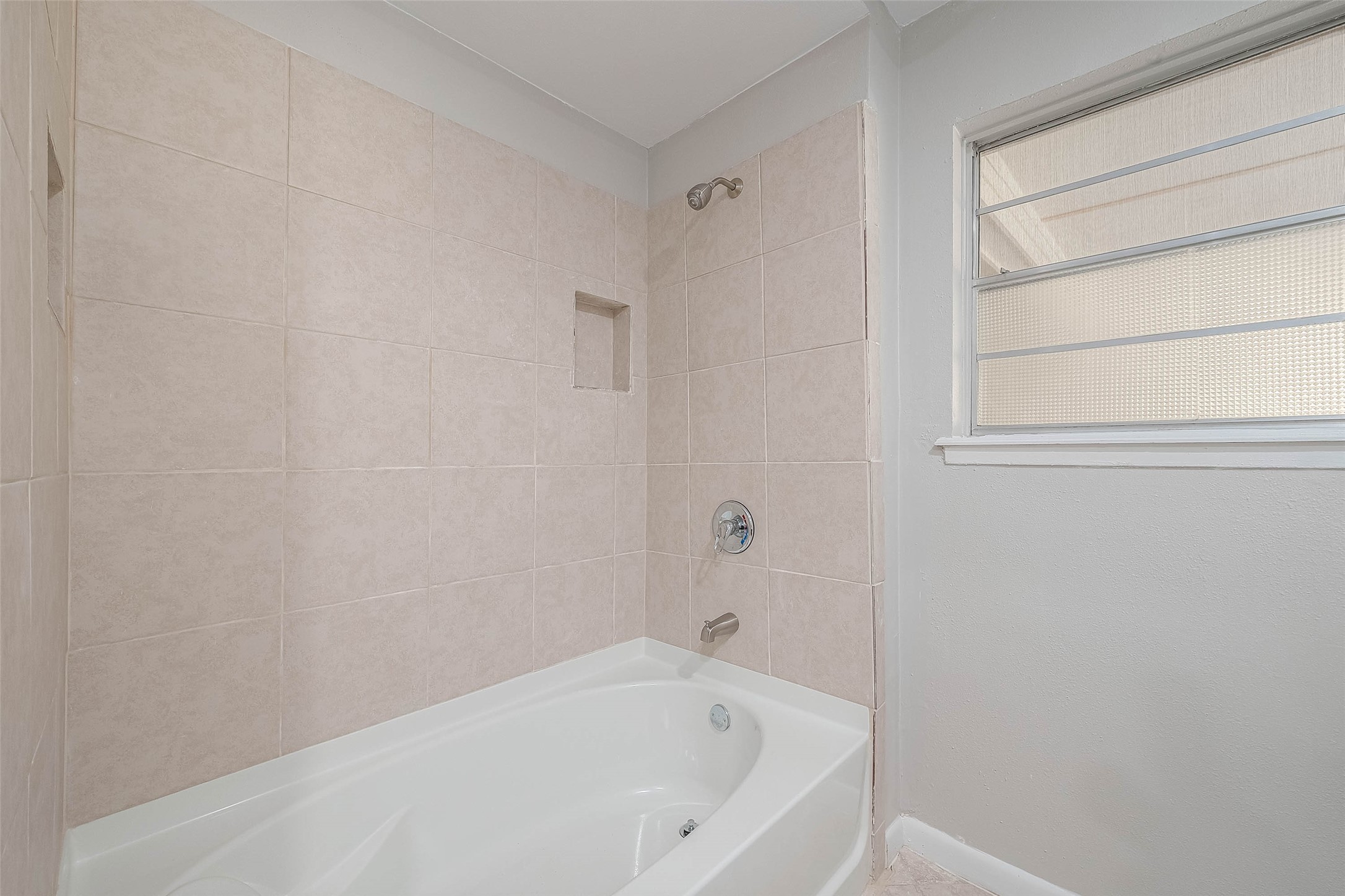 1503 Miles Street Rosenberg, TX 77471 - Photo 21 of 25 a white bath tub sitting next to a window