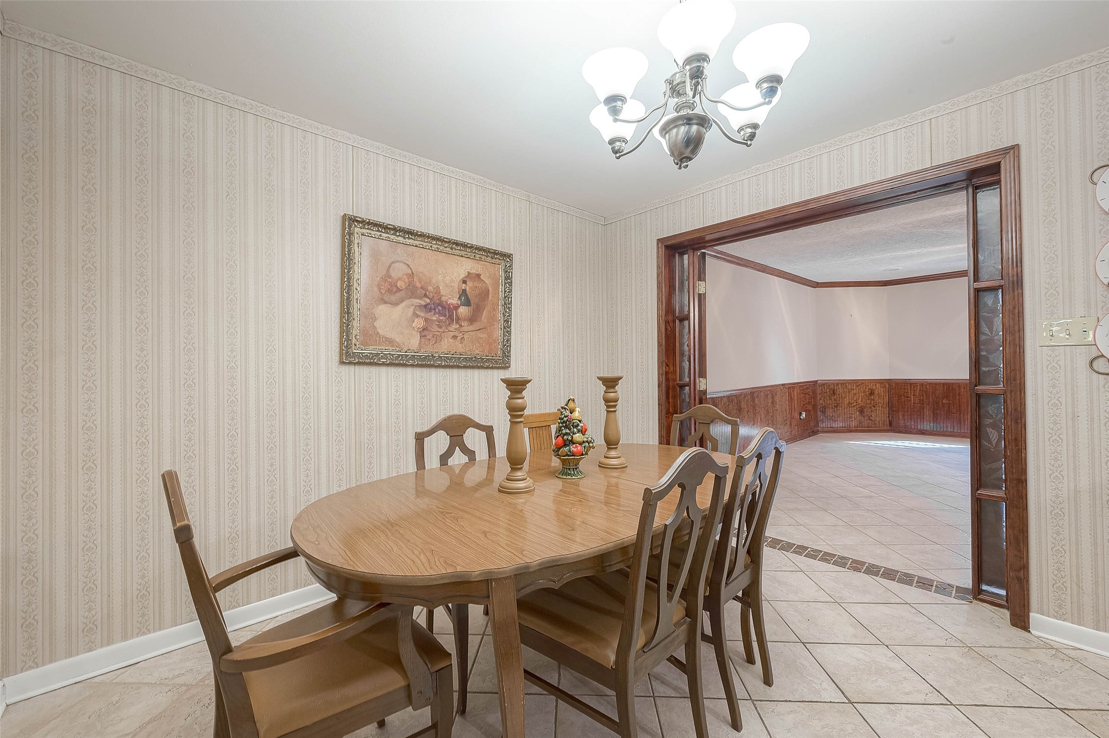 1503 Miles Street Rosenberg, TX 77471 - Photo 9 of 25 a view of a dining room with furniture and a chandelier