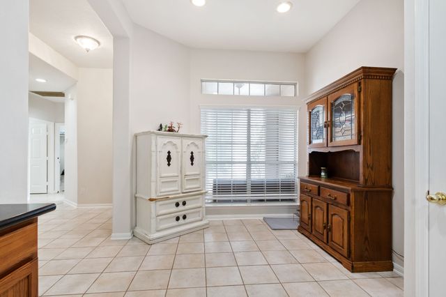 a kitchen with granite countertop a sink and a stove top oven